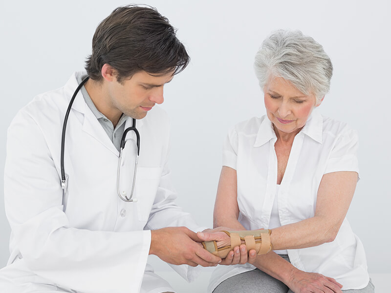 Doctor treating patient with Geriatric Orthopaedics